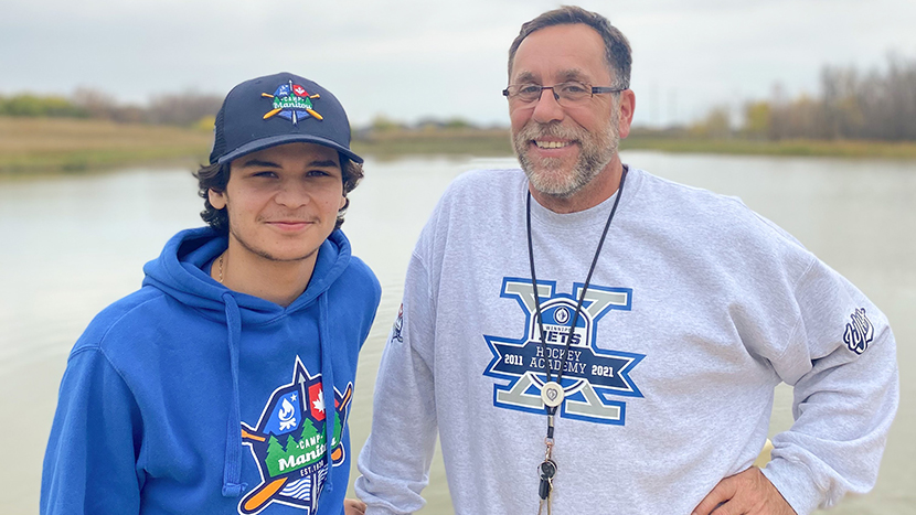 Jim and Tyrin at Camp Manitou smiling for a picture.